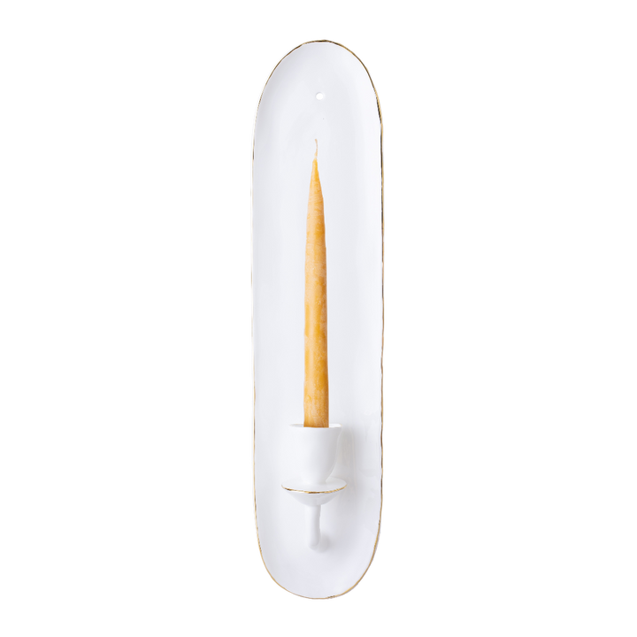 Decorative wall sconce with a white base and gold trim on a white background